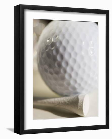 Golf Ball and Golf Tee-Tom Grill-Framed Photographic Print