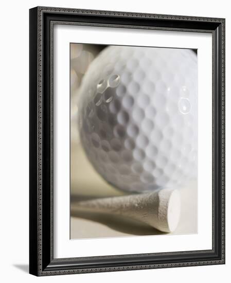 Golf Ball and Golf Tee-Tom Grill-Framed Photographic Print