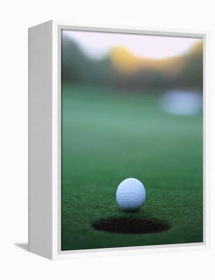 Golf Ball Close to Hole-Robert Llewellyn-Framed Premier Image Canvas