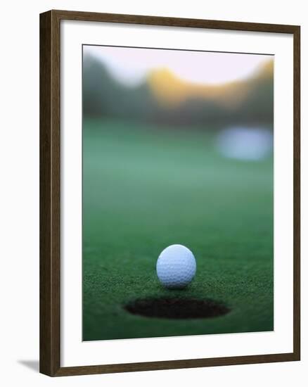 Golf Ball Close to Hole-Robert Llewellyn-Framed Photographic Print