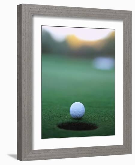 Golf Ball Close to Hole-Robert Llewellyn-Framed Photographic Print