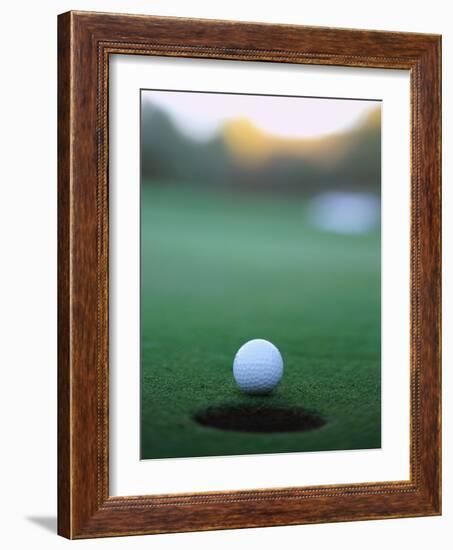 Golf Ball Close to Hole-Robert Llewellyn-Framed Photographic Print