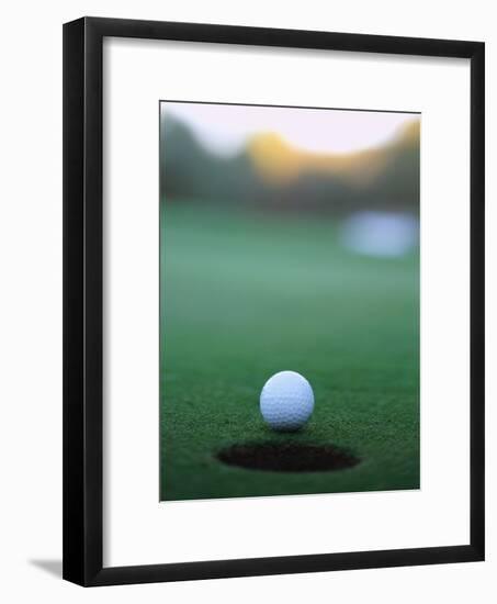 Golf Ball Close to Hole-Robert Llewellyn-Framed Photographic Print