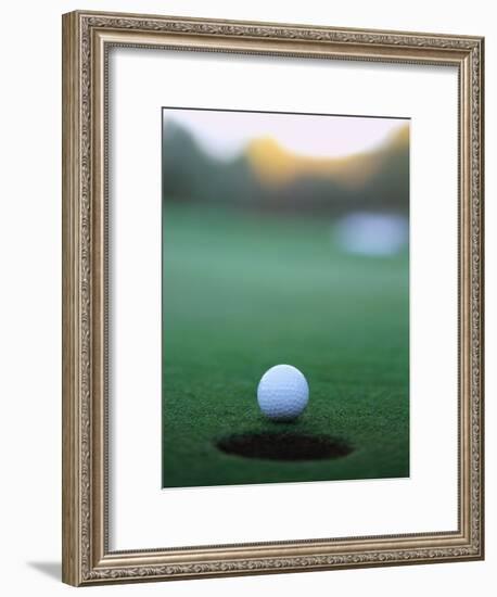 Golf Ball Close to Hole-Robert Llewellyn-Framed Photographic Print