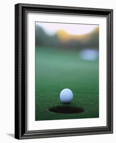 Golf Ball Close to Hole-Robert Llewellyn-Framed Photographic Print