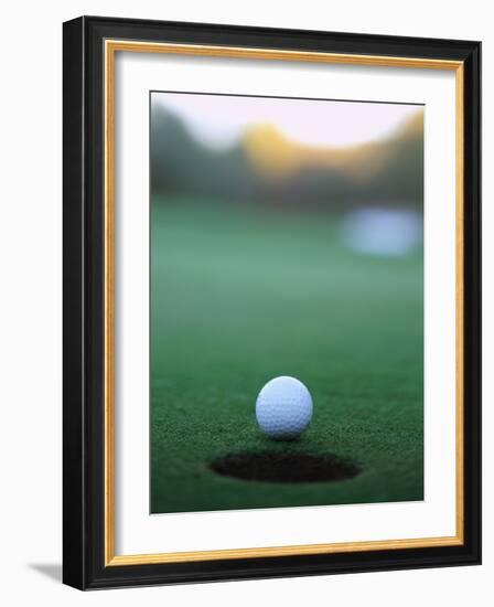 Golf Ball Close to Hole-Robert Llewellyn-Framed Photographic Print