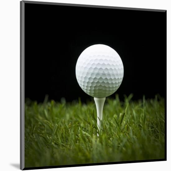 Golf Ball on Tee Black Back-null-Mounted Art Print