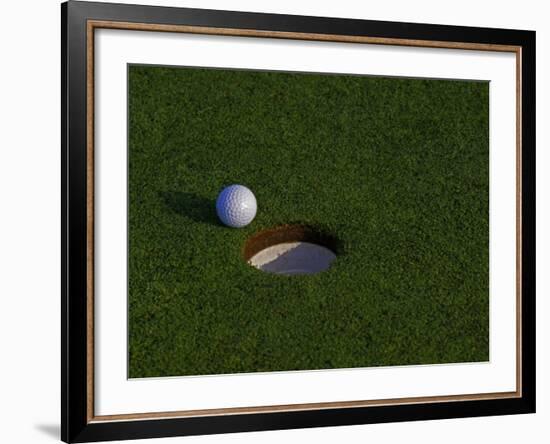 Golf Ball Sitting Near the Hole-null-Framed Photographic Print