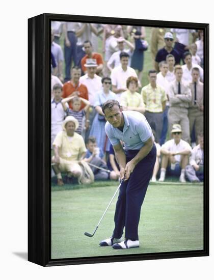 Golfer Arnold Palmer Lining Up Putt as Spectators Look on at Event-John Dominis-Framed Premier Image Canvas