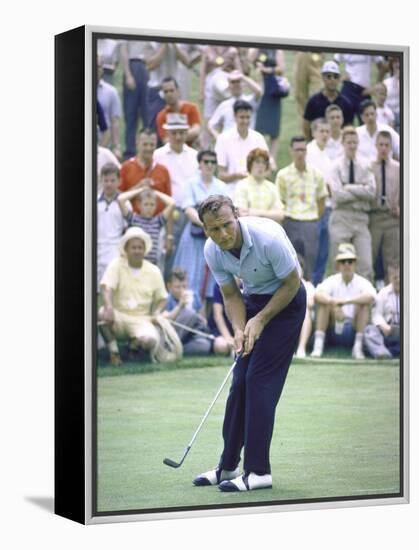 Golfer Arnold Palmer Lining Up Putt as Spectators Look on at Event-John Dominis-Framed Premier Image Canvas