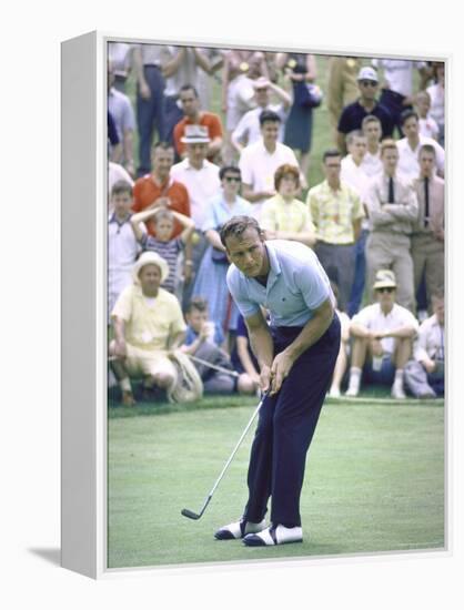 Golfer Arnold Palmer Lining Up Putt as Spectators Look on at Event-John Dominis-Framed Premier Image Canvas