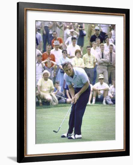 Golfer Arnold Palmer Lining Up Putt as Spectators Look on at Event-John Dominis-Framed Premium Photographic Print