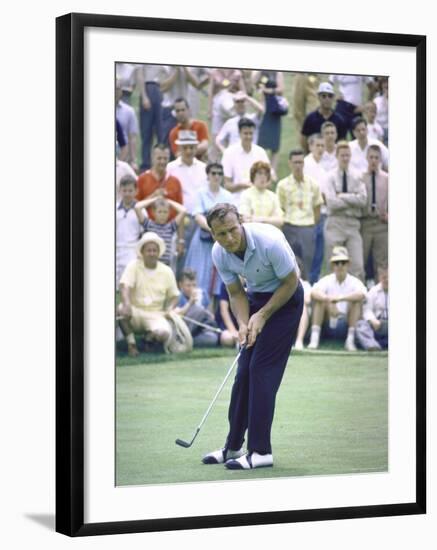 Golfer Arnold Palmer Lining Up Putt as Spectators Look on at Event-John Dominis-Framed Premium Photographic Print