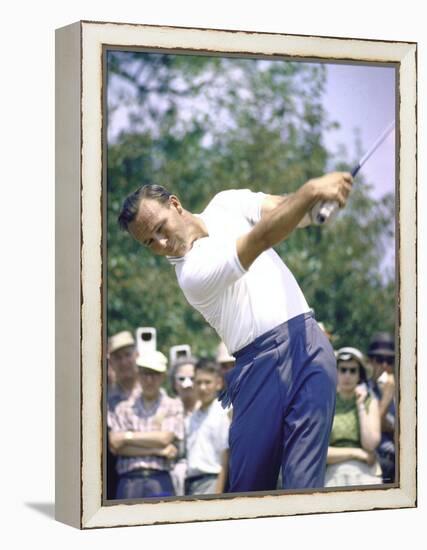 Golfer Arnold Palmer Swinging Club as Spectators Look on at Event-John Dominis-Framed Premier Image Canvas