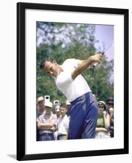 Golfer Arnold Palmer Swinging Club as Spectators Look on at Event-John Dominis-Framed Premium Photographic Print