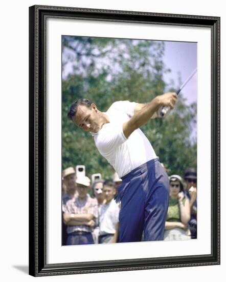 Golfer Arnold Palmer Swinging Club as Spectators Look on at Event-John Dominis-Framed Premium Photographic Print