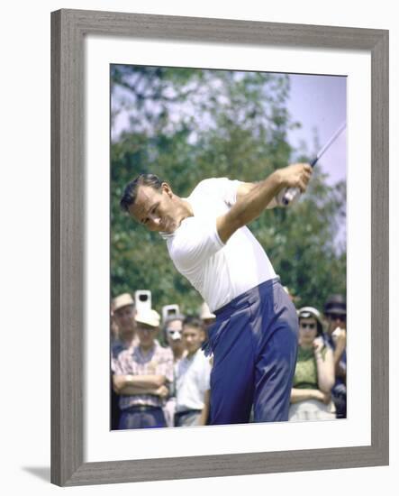 Golfer Arnold Palmer Swinging Club as Spectators Look on at Event-John Dominis-Framed Premium Photographic Print