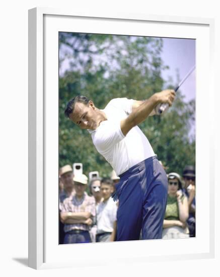 Golfer Arnold Palmer Swinging Club as Spectators Look on at Event-John Dominis-Framed Premium Photographic Print