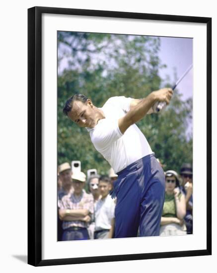 Golfer Arnold Palmer Swinging Club as Spectators Look on at Event-John Dominis-Framed Premium Photographic Print