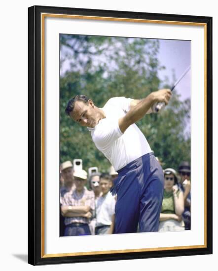 Golfer Arnold Palmer Swinging Club as Spectators Look on at Event-John Dominis-Framed Premium Photographic Print