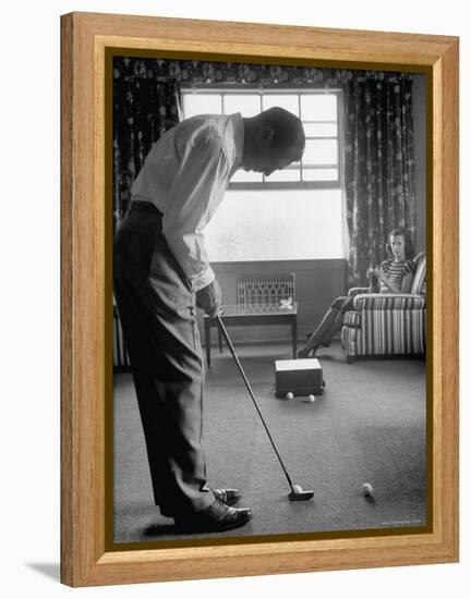 Golfer Ben Hogan Practicing Putting in His town house with Wife Valerie Watching from Armchair-Loomis Dean-Framed Premier Image Canvas