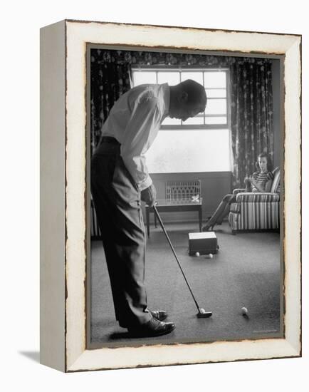 Golfer Ben Hogan Practicing Putting in His town house with Wife Valerie Watching from Armchair-Loomis Dean-Framed Premier Image Canvas