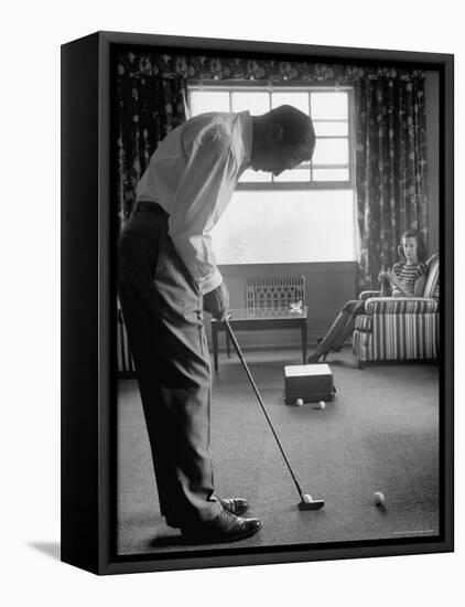 Golfer Ben Hogan Practicing Putting in His town house with Wife Valerie Watching from Armchair-Loomis Dean-Framed Premier Image Canvas