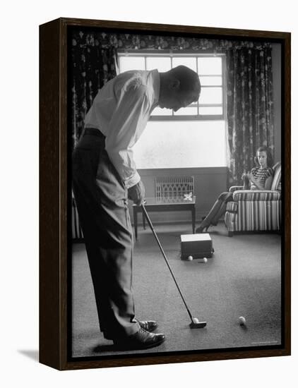 Golfer Ben Hogan Practicing Putting in His town house with Wife Valerie Watching from Armchair-Loomis Dean-Framed Premier Image Canvas