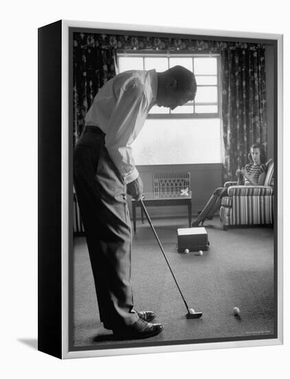 Golfer Ben Hogan Practicing Putting in His town house with Wife Valerie Watching from Armchair-Loomis Dean-Framed Premier Image Canvas