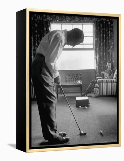 Golfer Ben Hogan Practicing Putting in His town house with Wife Valerie Watching from Armchair-Loomis Dean-Framed Premier Image Canvas