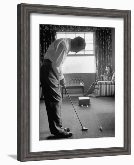 Golfer Ben Hogan Practicing Putting in His town house with Wife Valerie Watching from Armchair-Loomis Dean-Framed Premium Photographic Print
