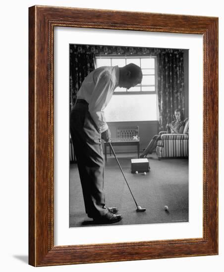 Golfer Ben Hogan Practicing Putting in His town house with Wife Valerie Watching from Armchair-Loomis Dean-Framed Premium Photographic Print