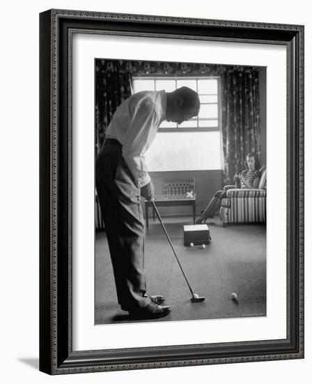 Golfer Ben Hogan Practicing Putting in His town house with Wife Valerie Watching from Armchair-Loomis Dean-Framed Premium Photographic Print