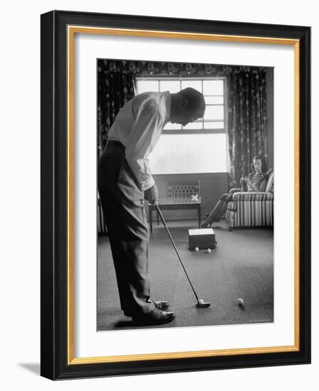 Golfer Ben Hogan Practicing Putting in His town house with Wife Valerie Watching from Armchair-Loomis Dean-Framed Premium Photographic Print