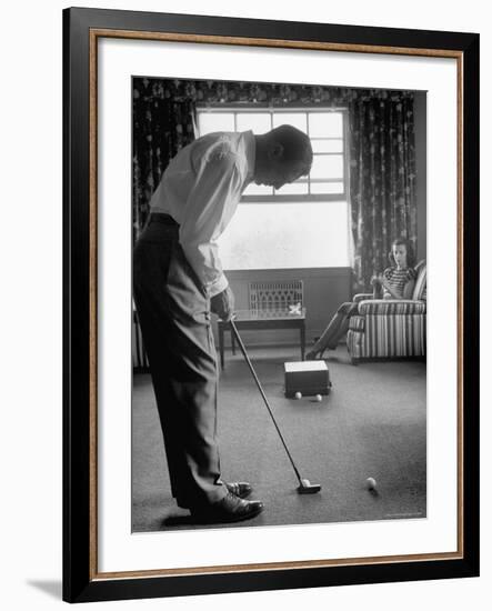 Golfer Ben Hogan Practicing Putting in His town house with Wife Valerie Watching from Armchair-Loomis Dean-Framed Premium Photographic Print