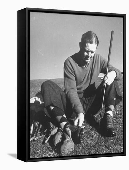 Golfer Byron Nelson Cleaning the Cleats on His Shoes-Gabriel Benzur-Framed Premier Image Canvas