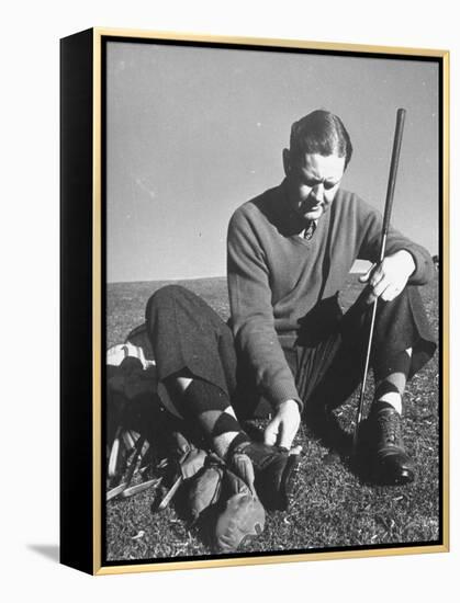Golfer Byron Nelson Cleaning the Cleats on His Shoes-Gabriel Benzur-Framed Premier Image Canvas