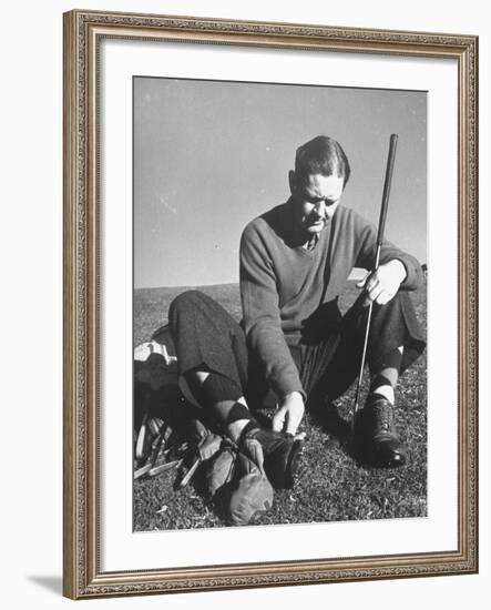 Golfer Byron Nelson Cleaning the Cleats on His Shoes-Gabriel Benzur-Framed Premium Photographic Print