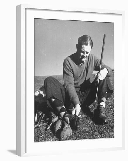 Golfer Byron Nelson Cleaning the Cleats on His Shoes-Gabriel Benzur-Framed Premium Photographic Print