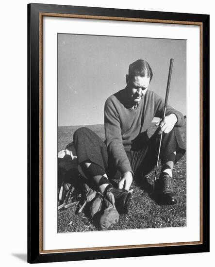 Golfer Byron Nelson Cleaning the Cleats on His Shoes-Gabriel Benzur-Framed Premium Photographic Print