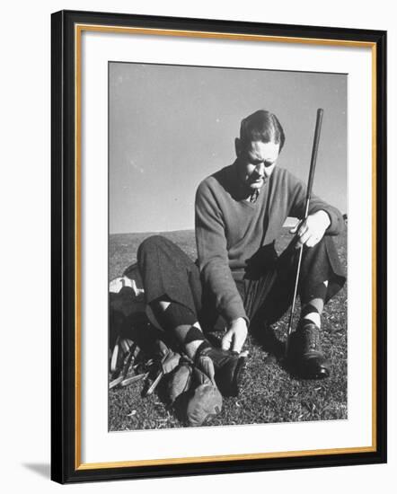 Golfer Byron Nelson Cleaning the Cleats on His Shoes-Gabriel Benzur-Framed Premium Photographic Print