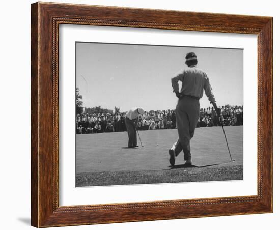 Golfer Putting the 12th Green-null-Framed Photographic Print