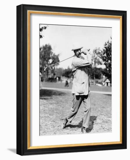 Golfer Ted Ray Swinging a Club Photograph-Lantern Press-Framed Art Print