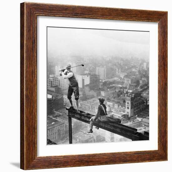 Golfer Teeing off on Girder High above City-null-Framed Premium Photographic Print