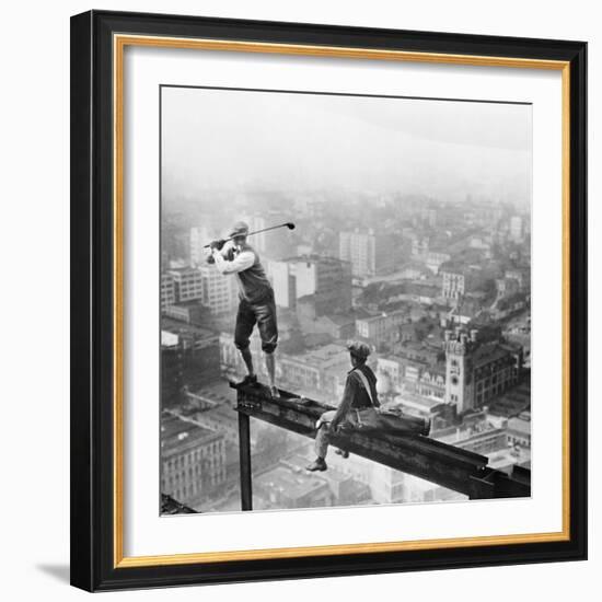 Golfer Teeing off on Girder High above City-null-Framed Premium Photographic Print