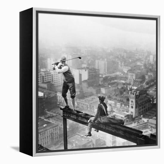 Golfer Teeing off on Girder High above City-null-Framed Premier Image Canvas