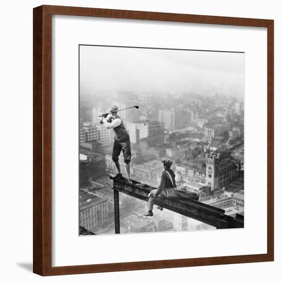 Golfer Teeing off on Girder High above City-null-Framed Photographic Print