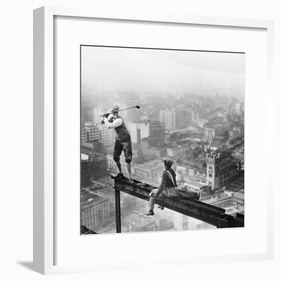 Golfer Teeing off on Girder High above City-null-Framed Photographic Print