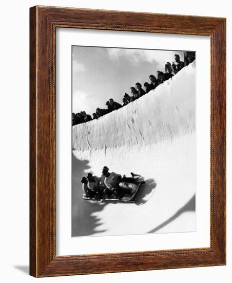 Good of Cresta Run, Bobsled Run, Coasting around Sunny Bend as People Peer from Above the Track-Alfred Eisenstaedt-Framed Photographic Print