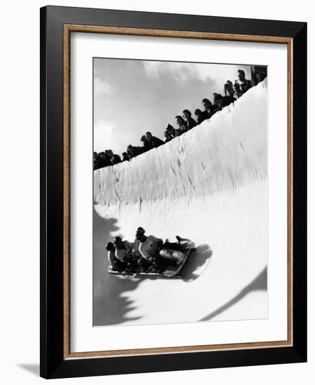 Good of Cresta Run, Bobsled Run, Coasting around Sunny Bend as People Peer from Above the Track-Alfred Eisenstaedt-Framed Photographic Print